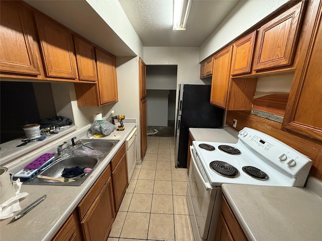 kitchen with brown cabinets, light tile patterned floors, light countertops, a sink, and white appliances