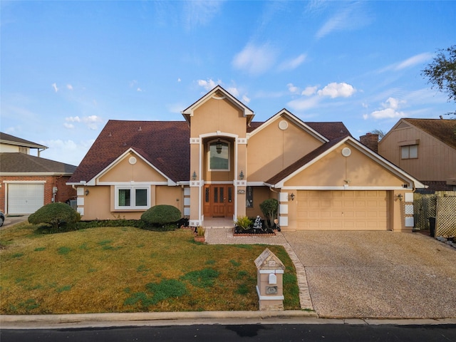 view of front facade featuring a garage and a front lawn