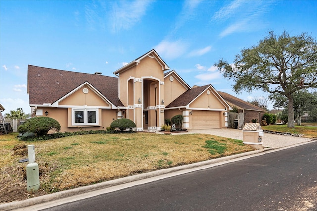 view of front of property featuring a garage and a front lawn