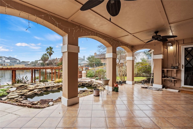 view of patio featuring a water view