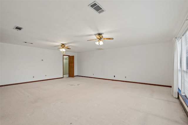 unfurnished room featuring light carpet and ceiling fan