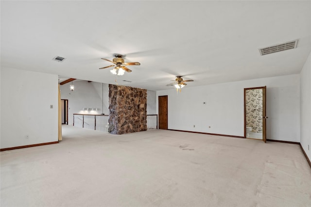 unfurnished room featuring light colored carpet and ceiling fan