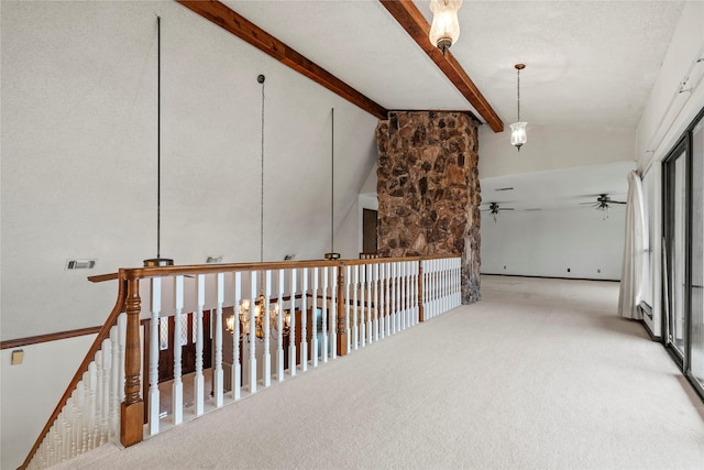 hall featuring light carpet, beam ceiling, and high vaulted ceiling