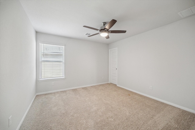 carpeted empty room with ceiling fan