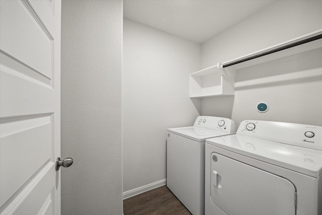 laundry room with dark wood-type flooring and independent washer and dryer