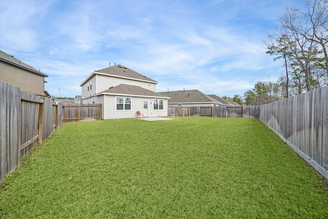 back of property featuring a yard