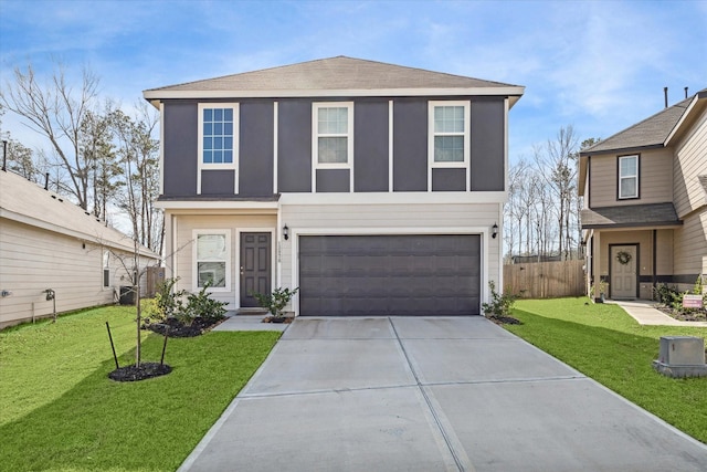 front of property featuring a garage and a front lawn