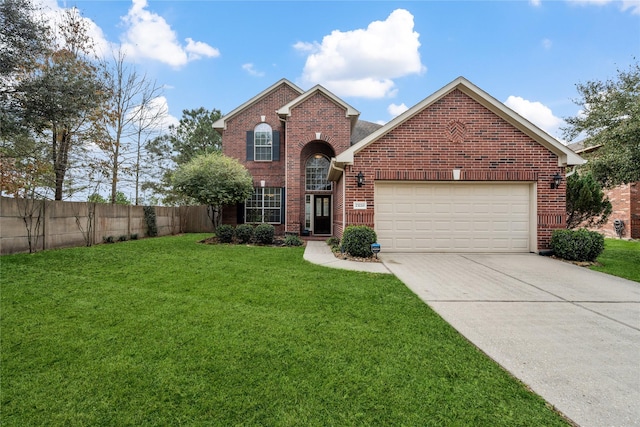 view of front property featuring a garage and a front lawn