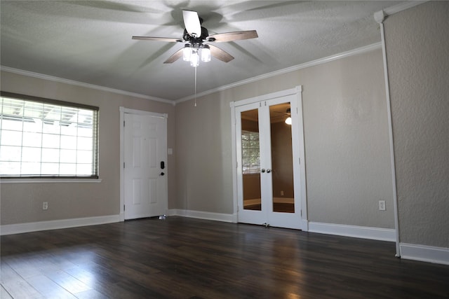 unfurnished room with french doors, ornamental molding, dark hardwood / wood-style flooring, and a wealth of natural light