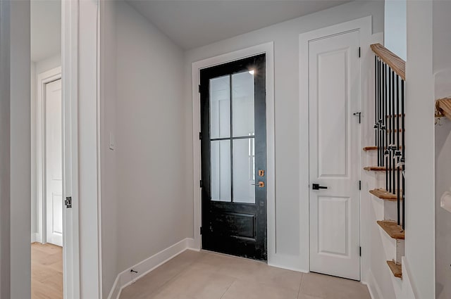 entryway featuring light tile patterned floors