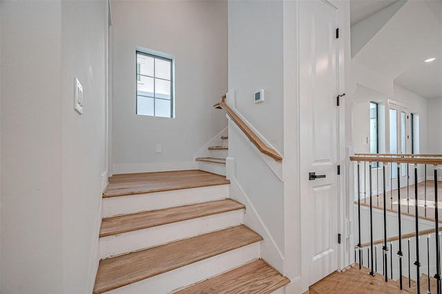 stairway featuring hardwood / wood-style flooring