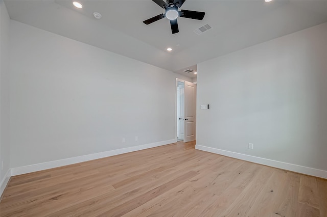 spare room featuring ceiling fan and light hardwood / wood-style floors