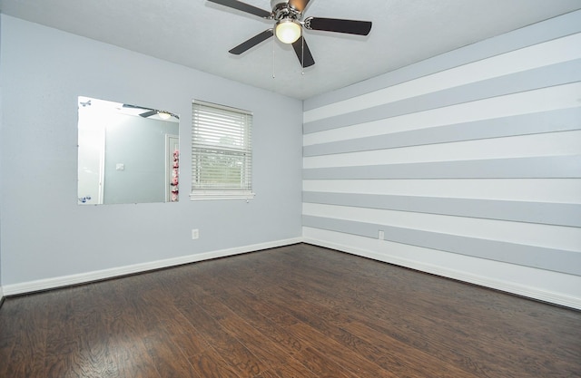 unfurnished room with ceiling fan, baseboards, and wood finished floors