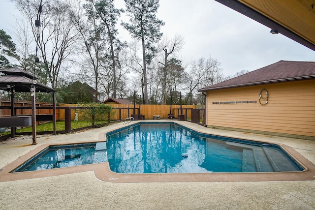 view of swimming pool featuring a patio, a fenced backyard, and a fenced in pool