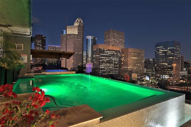 view of pool at night