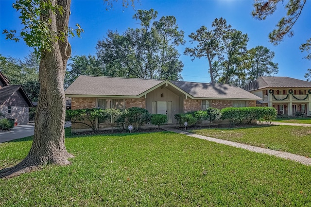 ranch-style house with a front yard