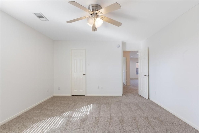 carpeted empty room with ceiling fan