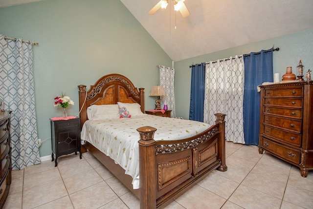 tiled bedroom with high vaulted ceiling and ceiling fan