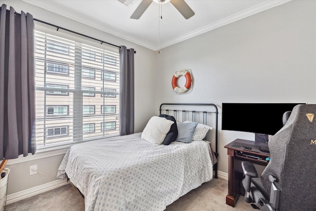 bedroom featuring light carpet, crown molding, and ceiling fan