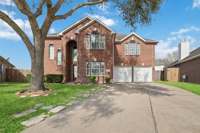 view of front of house with a garage and a front yard