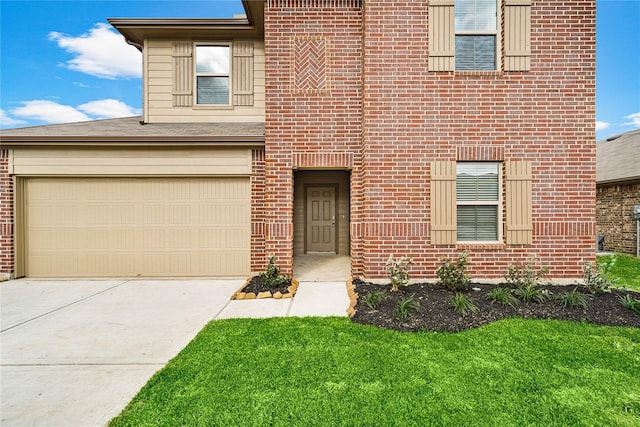 view of front facade featuring a garage and a front lawn