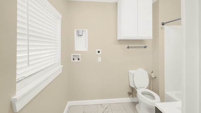 bathroom with toilet and a bathtub