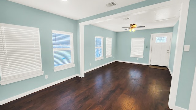 foyer with ceiling fan, dark hardwood / wood-style floors, and a wealth of natural light