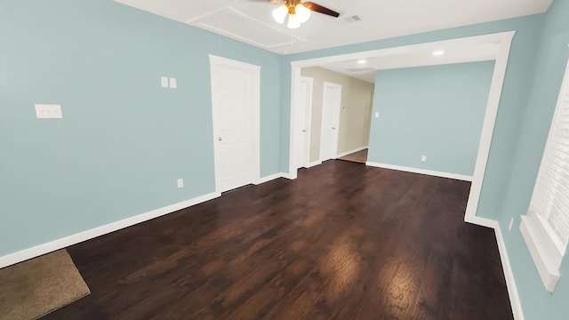 empty room featuring dark hardwood / wood-style floors and ceiling fan