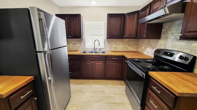 kitchen featuring range with electric stovetop, butcher block countertops, stainless steel refrigerator, tasteful backsplash, and sink