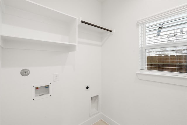 clothes washing area featuring hookup for a washing machine, laundry area, hookup for an electric dryer, hookup for a gas dryer, and baseboards