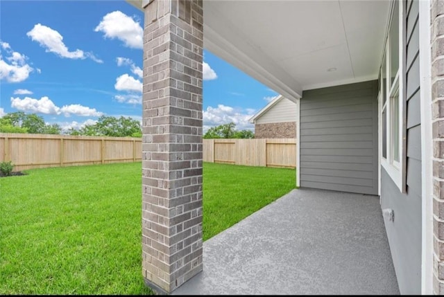 view of yard featuring a patio and a fenced backyard