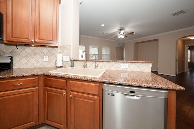 kitchen with dishwasher, sink, crown molding, and kitchen peninsula