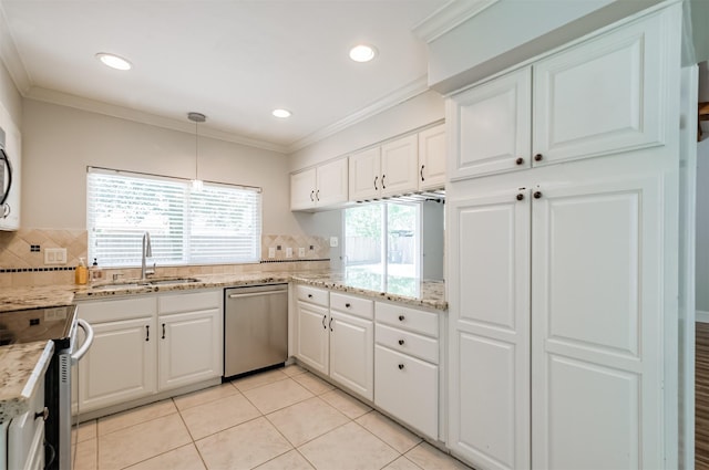 kitchen with sink, crown molding, white cabinetry, stainless steel appliances, and decorative light fixtures