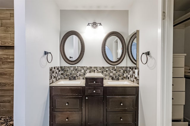 bathroom featuring tasteful backsplash and vanity