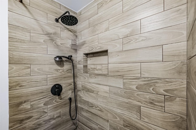 room details featuring a tile shower