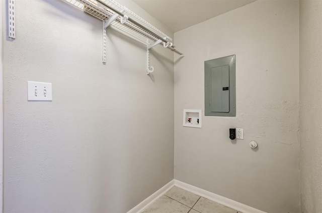 laundry area with gas dryer hookup, light tile patterned floors, electric panel, hookup for a washing machine, and electric dryer hookup