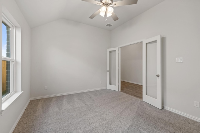 27603 Beachside Arbor Dr, Katy, TX 77493 - carpeted empty room with french doors, vaulted ceiling, a ceiling fan, and baseboards