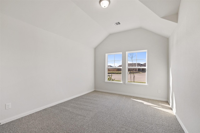 27603 Beachside Arbor Dr, Katy, TX 77493 - bonus room featuring carpet, lofted ceiling, and baseboards