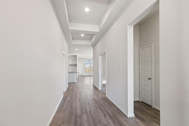 27603 Beachside Arbor Dr, Katy, TX 77493 - corridor with wood finished floors, baseboards, recessed lighting, and a sink
