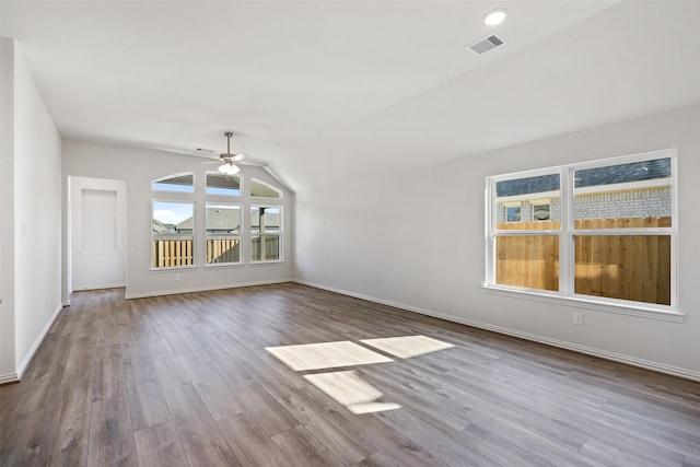 27603 Beachside Arbor Dr, Katy, TX 77493 - unfurnished living room featuring ceiling fan, wood finished floors, baseboards, and vaulted ceiling