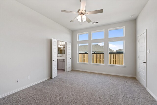 27603 Beachside Arbor Dr, Katy, TX 77493 - spare room featuring light colored carpet, ceiling fan, baseboards, and a smoke detector