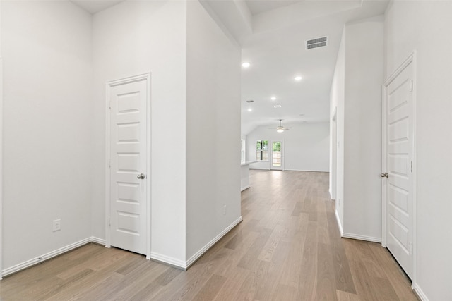 5830 Westwood Shore Dr, Katy, TX 77493 - hall with light wood finished floors, vaulted ceiling, baseboards, and recessed lighting