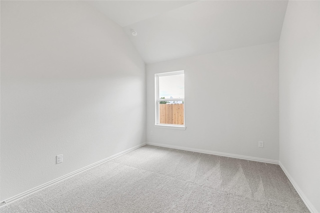5830 Westwood Shore Dr, Katy, TX 77493 - carpeted empty room with baseboards and lofted ceiling