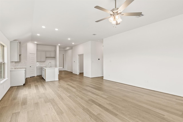 5830 Westwood Shore Dr, Katy, TX 77493 - unfurnished living room featuring light wood-style flooring, recessed lighting, and ceiling fan