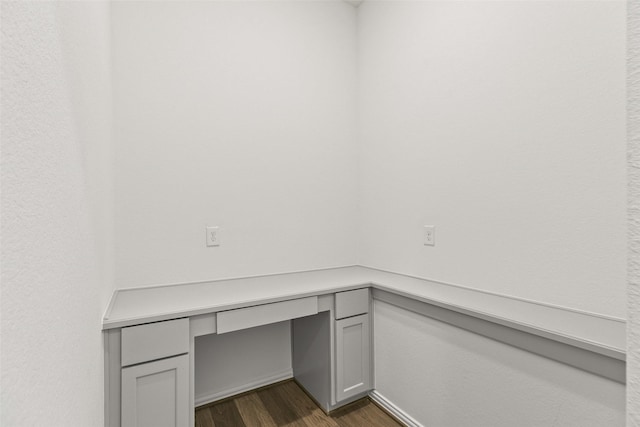 5830 Westwood Shore Dr, Katy, TX 77493 - unfurnished office featuring dark wood-style floors and built in desk