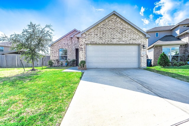 view of front of house featuring a garage and a front yard