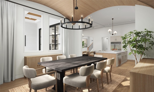 dining space featuring arched walkways, a notable chandelier, light wood finished floors, lofted ceiling, and stairway