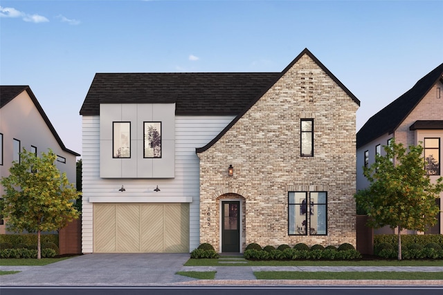 view of front of home featuring driveway, an attached garage, roof with shingles, and brick siding