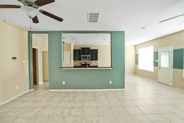 unfurnished living room with ceiling fan and light tile patterned floors