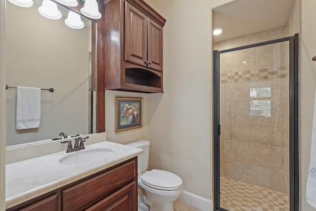 bathroom featuring a shower with door, vanity, and toilet